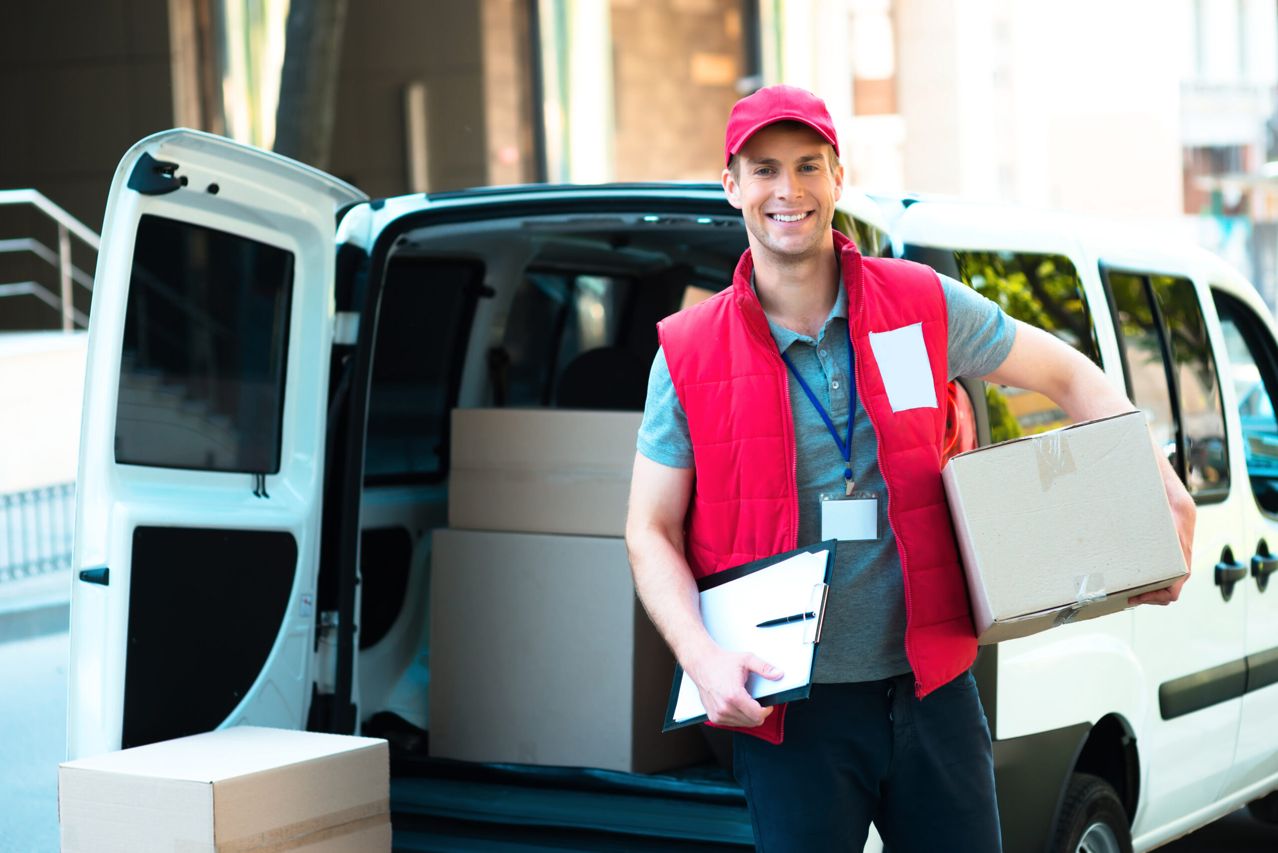 courier with clipboard delivering package